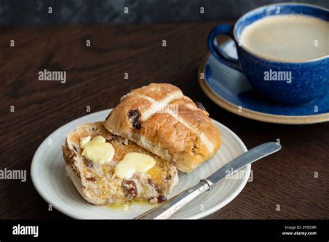 A Easter Hot Cross Bun Toasted And Served With Butter Which Is Melting On The Warm Bun