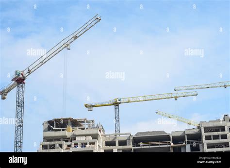 Construction Site Construction Cranes And High Rise Building Under