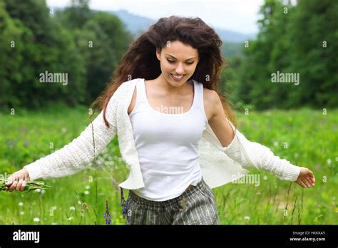 Happy Pretty Brunette Woman In Chamomile Field Cute Female Relaxed On Flowers Meadow Spring