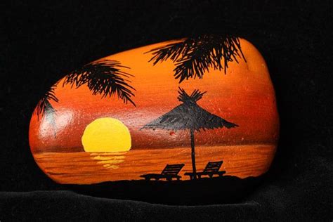 Painted Rock Stone Setting Sun On A Tropical Beach Of The Caribbean