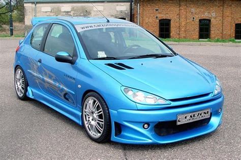 Тюнинг Пежо, фото тюнинга салона и оптики Peugeot 206