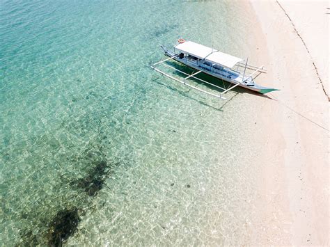 Aerial View Of A Boat Moored On A Beach The Philippines By Stocksy