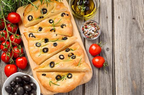 Premium Photo Italian Focaccia Bread With Olives And Rosemary On