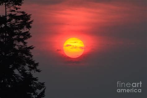 Smoky Sunset Photograph By Jan Noblitt Fine Art America