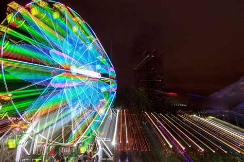 Premium Photo Blurred Motion Of Illuminated Ferris Wheel At Night