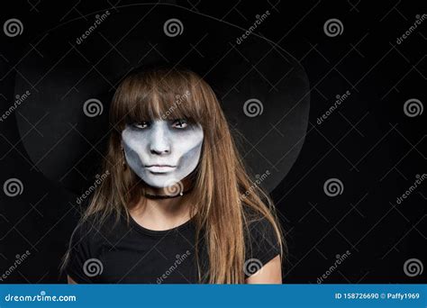 Closeup Of Halloween Witch Girl Looking At Camera On Black Background