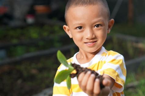 Premium Photo Concept Of Saving The World Boy Planting Trees