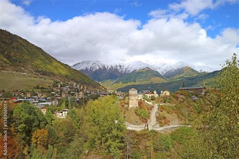 An Aerial View Of A Town Surrounded By Mountains