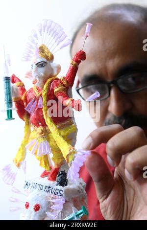 Samiran De, an artist works on an idol of Lord Ganesha made with soup ...