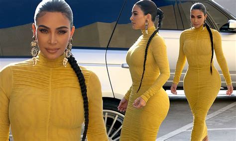 Kim Kardashian Puts Her Curves On Display In Very Tight Yellow Dress