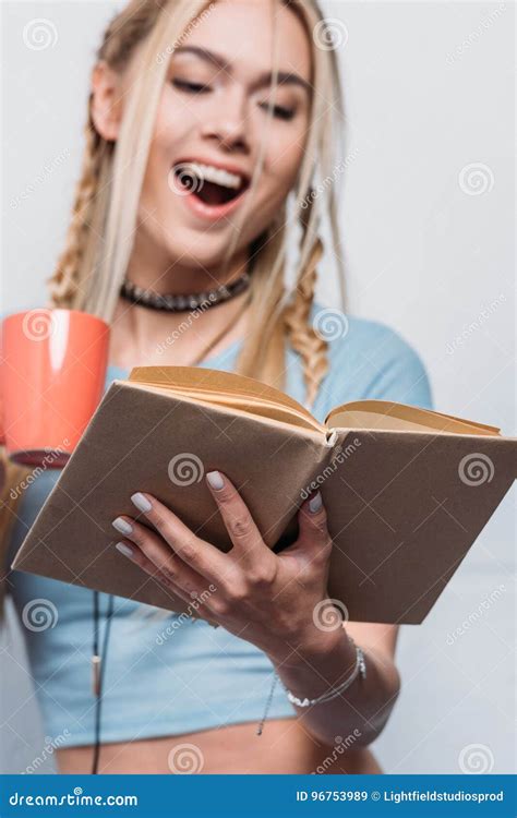 Girl Reading Book And Drinking Coffee With Facial Expression Stock Image Image Of Emotional