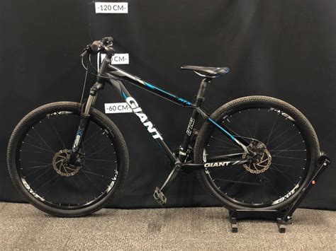 Black And Blue Giant Atx 27 Speed Front Suspension Mountain Bike With