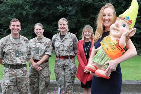 Workers Take Part In Garden Challenge For Gnome At Gosport Naval Base