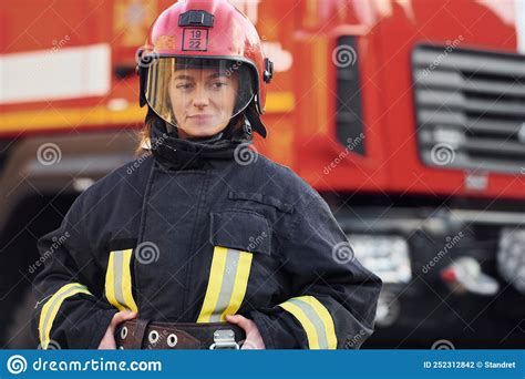 Female Firefighter in Protective Uniform Standing Near Truck Stock ...