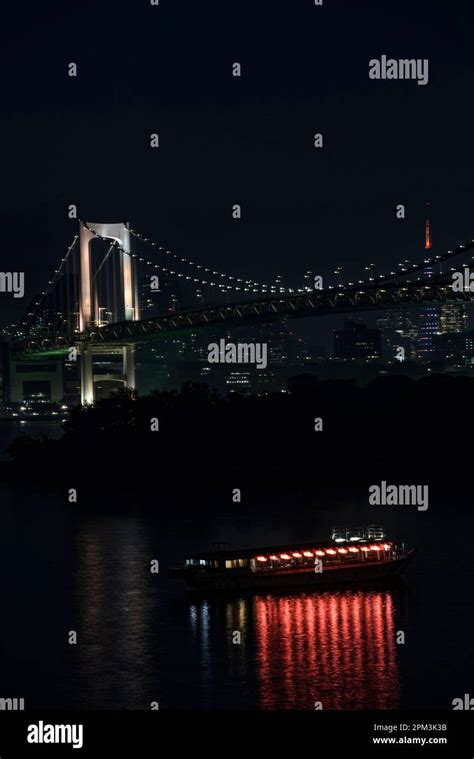 The Rainbow Bridge Is A Suspension Bridge Crossing Tokyo Bay Between