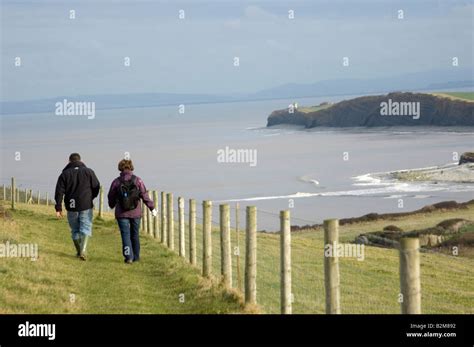 Walkers On Somerset Coastal Path Stock Photo Alamy