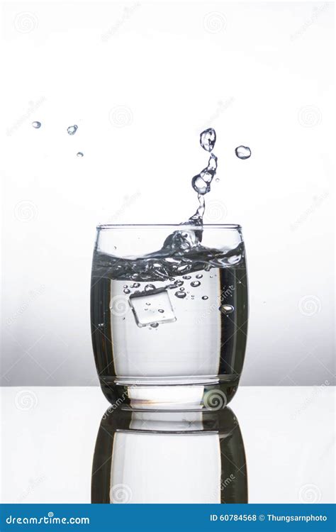 Ice Dropping Into A Glass Of Water Stock Photo Image Of Splashing