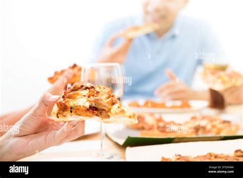 People eating pizza Stock Photo - Alamy