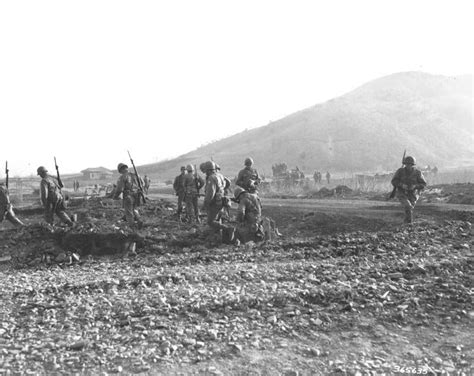 A squad of the 3rd Ranger Co., 3rd Infantry Division, moves out of ...