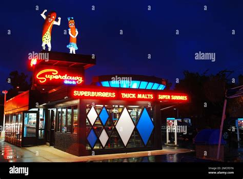 Two Large Hot Dogs Stand Atop Superdawg One Of Chicagos Legendary Hot