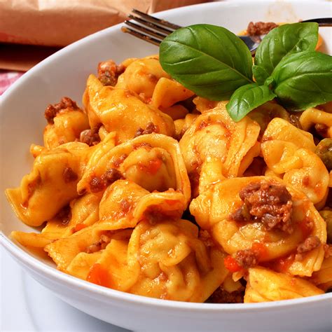 Cappelletti filled pasta with homemade meat sauce - Vittoria Caterina ...