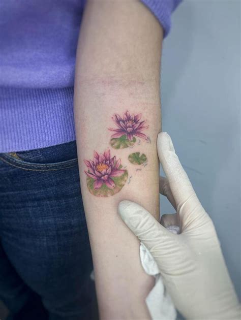 water lily tattoo ideas    bold delicate symbolic