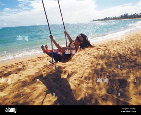 Swinging woman hi-res stock photography and images - Alamy