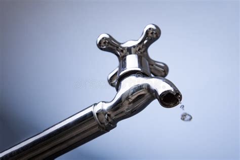 Drain Water From The Metal Tap Water Flowing From Modern Faucet Stock