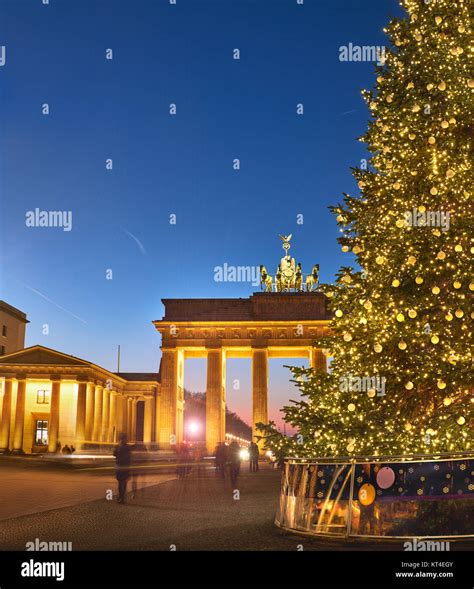 Brandenburger Gate In Berlin With Christmas Tree At Night With Evening