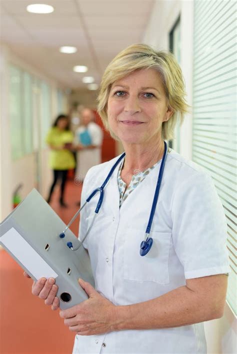 Mature Female Doctor Standing On Hospital Corridor Stock Image Image Of Practitioner