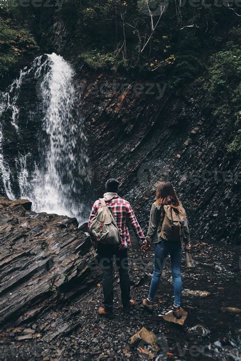 In The Amazing Place Full Length Rear View Of Young Couple Holding