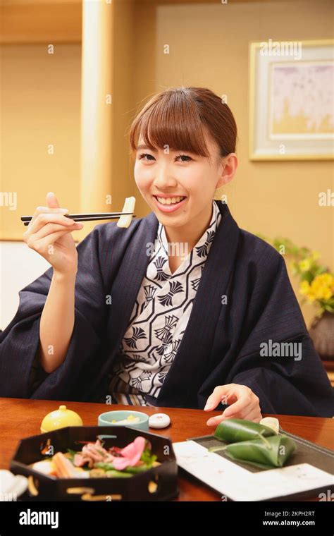 Japanese Woman Having Dinner At A Hot Spring Inn Stock Photo Alamy