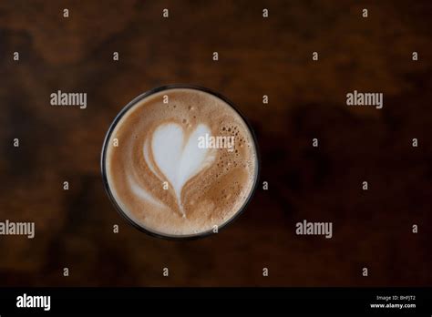 A Love Heart Drawn In Latte Art On Top Of A Tall Cafe Latte Coffee