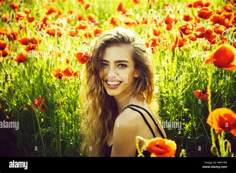 Girl In Field Of Poppy Seed Stock Photo Alamy