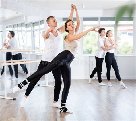 Ballet Partners Mastering Paired Technique At Group Class In Studio