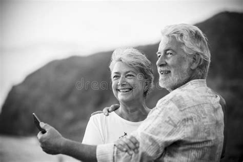 Beautiful Romantic Portrait Of Senior Happy Couple Smile And Hug