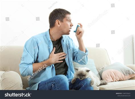 Man Using Asthma Inhaler Near Cat Stock Photo 1240725622 | Shutterstock