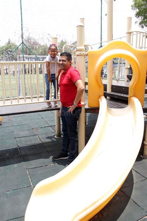 Latino And Brunette Single Dad And Daughter Play In The Park Get On Rides And Spend Quality