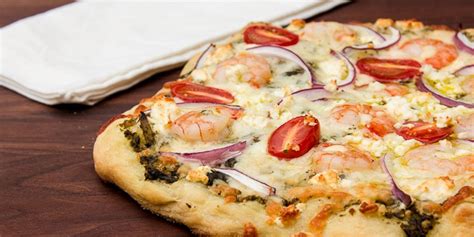 Shrimp And Pesto Pizza Made On The Grill Using A Pizza Stone