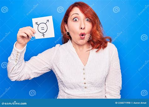 Redhead Woman Asking For Sex Discrimination Holding Paper With