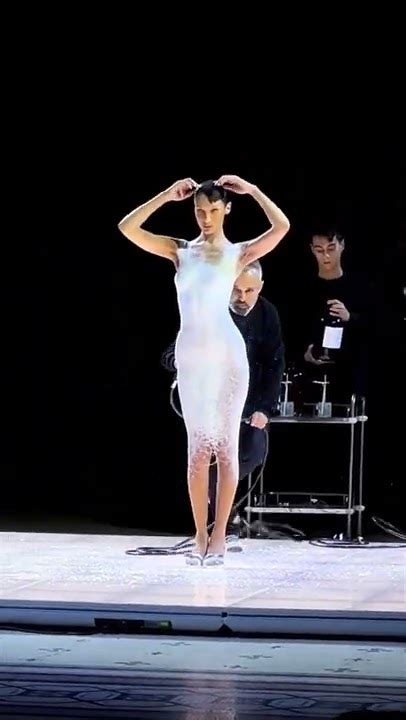 Bella Hadid Gets Dress Spray Painted Onto Her Mid Fashion Show Shorts