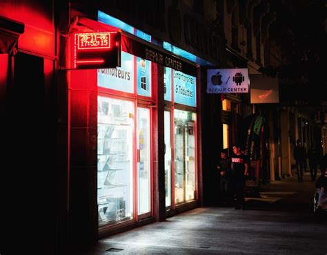 Red And White Store Front During Night Time · Free Stock Photo