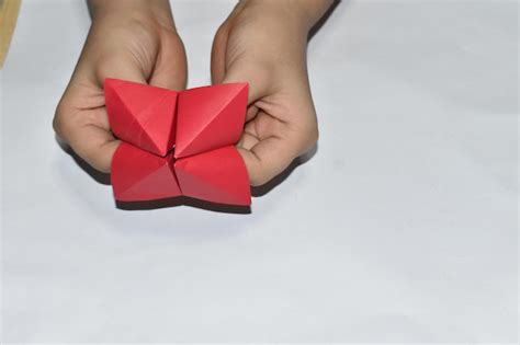 Premium Photo | Cropped hands holding origami