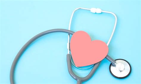 Premium Photo Stethoscope And Red Heart Shape On Blue Background