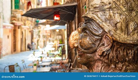 Via Dei Tribunali Street And Sculpture Of Pulcinella In Naples Old Town