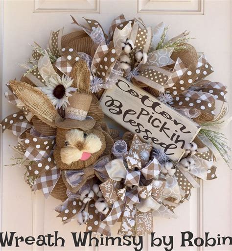 A Wreath That Is Hanging On The Front Door With Words Written In Black