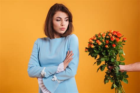 Angry Offended Young Woman Standing With Arms Crossed And Receiving