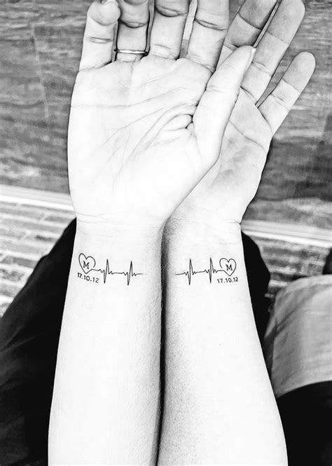 Two Wrist Tattoos With Heartbeats And Hearts On The Wrists One Is