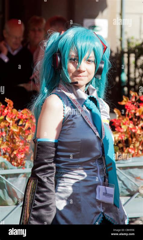 Girl dressed as Hatsune Miku, the persona of a singing simulator ...