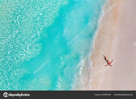 Aerial View Woman Lying Sandy Beach Stock Photo by ©icemanphotos 626367280